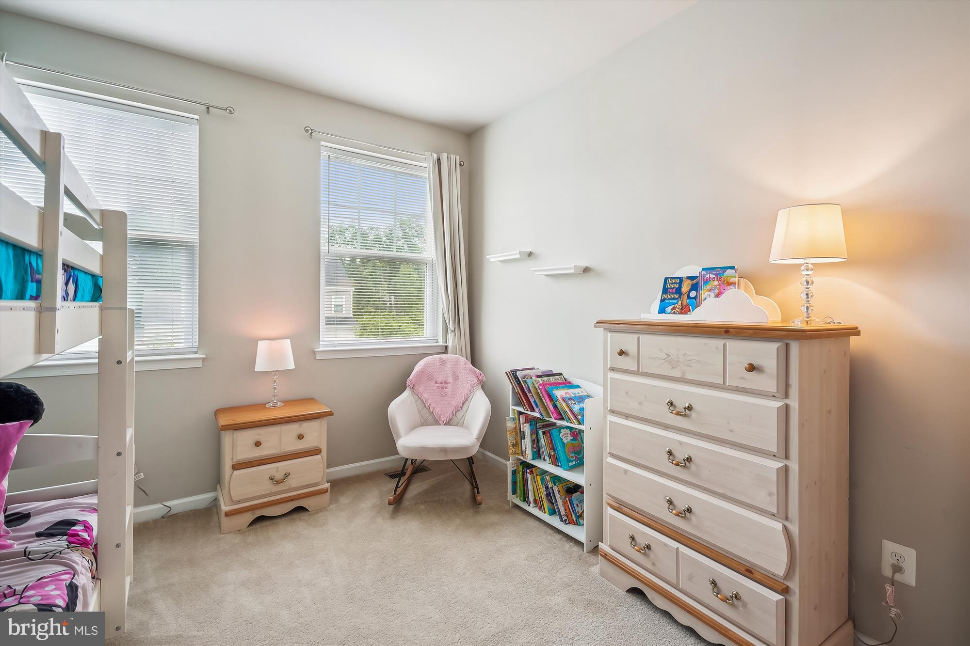12141 Aster Road Bristow, VA 20136 - Photo 40 of 65 a room with a baby bed a dresser and a window