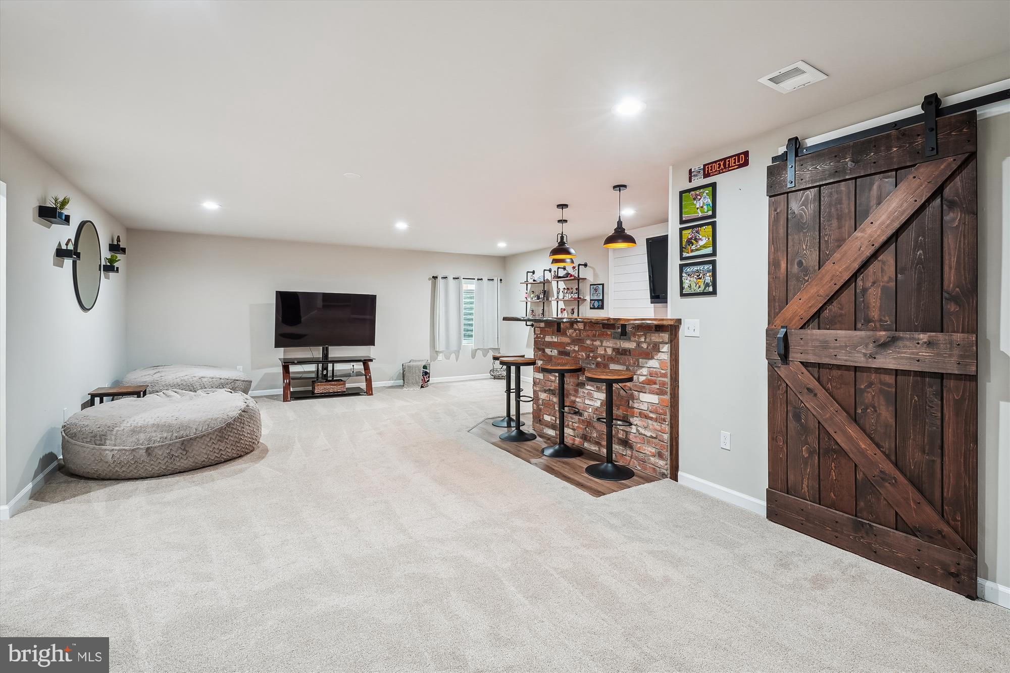 12141 Aster Road Bristow, VA 20136 - Photo 43 of 65 a room with furniture and a flat screen tv