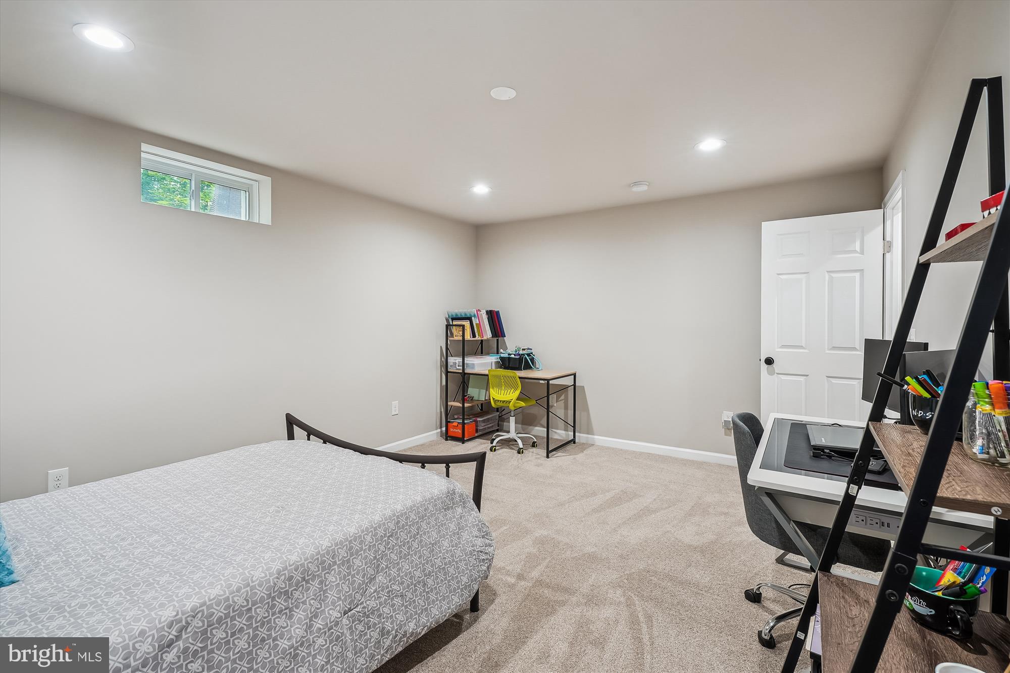 12141 Aster Road Bristow, VA 20136 - Photo 51 of 65 a bed room with a bed and a book shelf