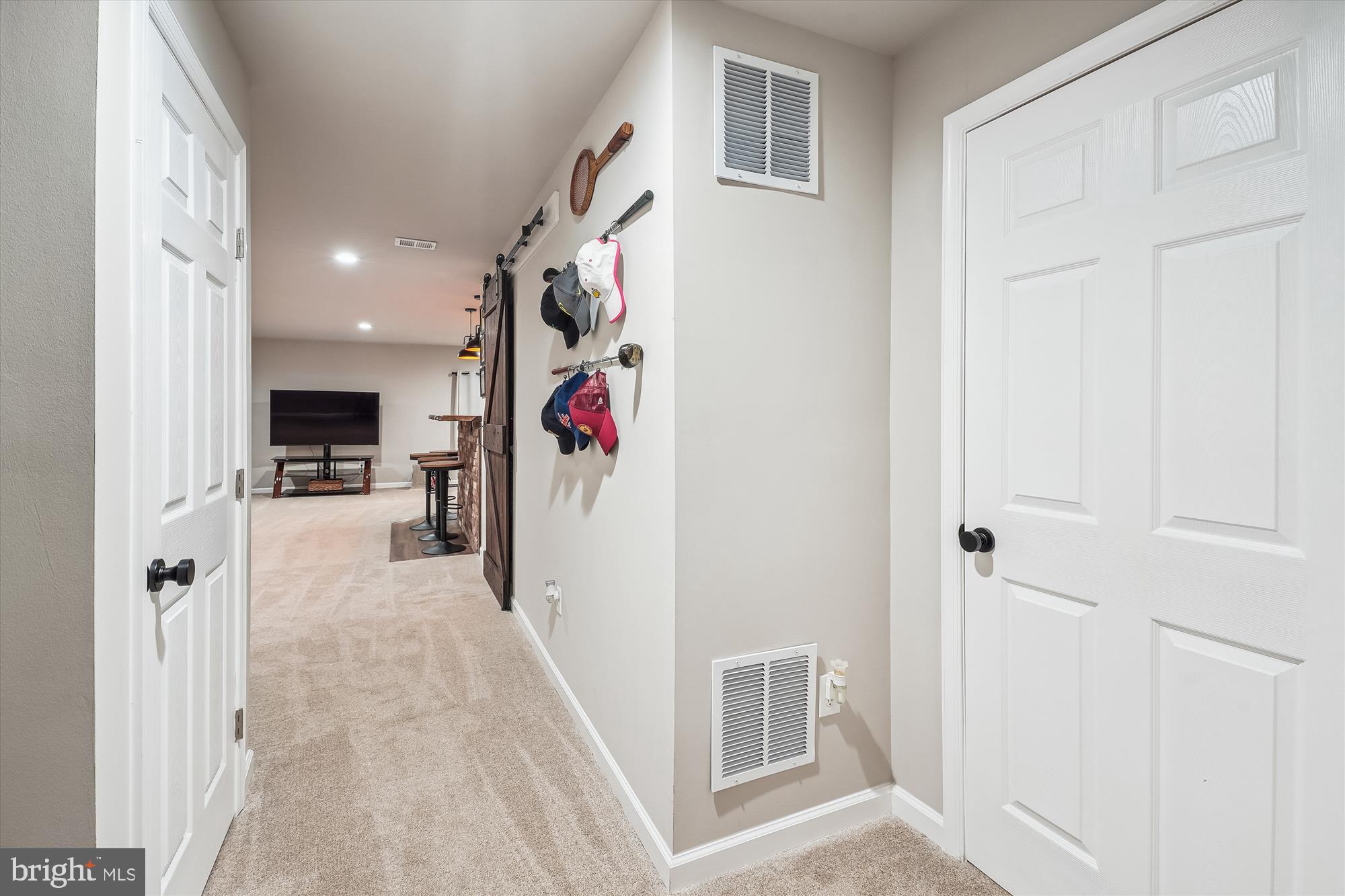 12141 Aster Road Bristow, VA 20136 - Photo 56 of 65 a view of a hallway with a livingroom and furniture