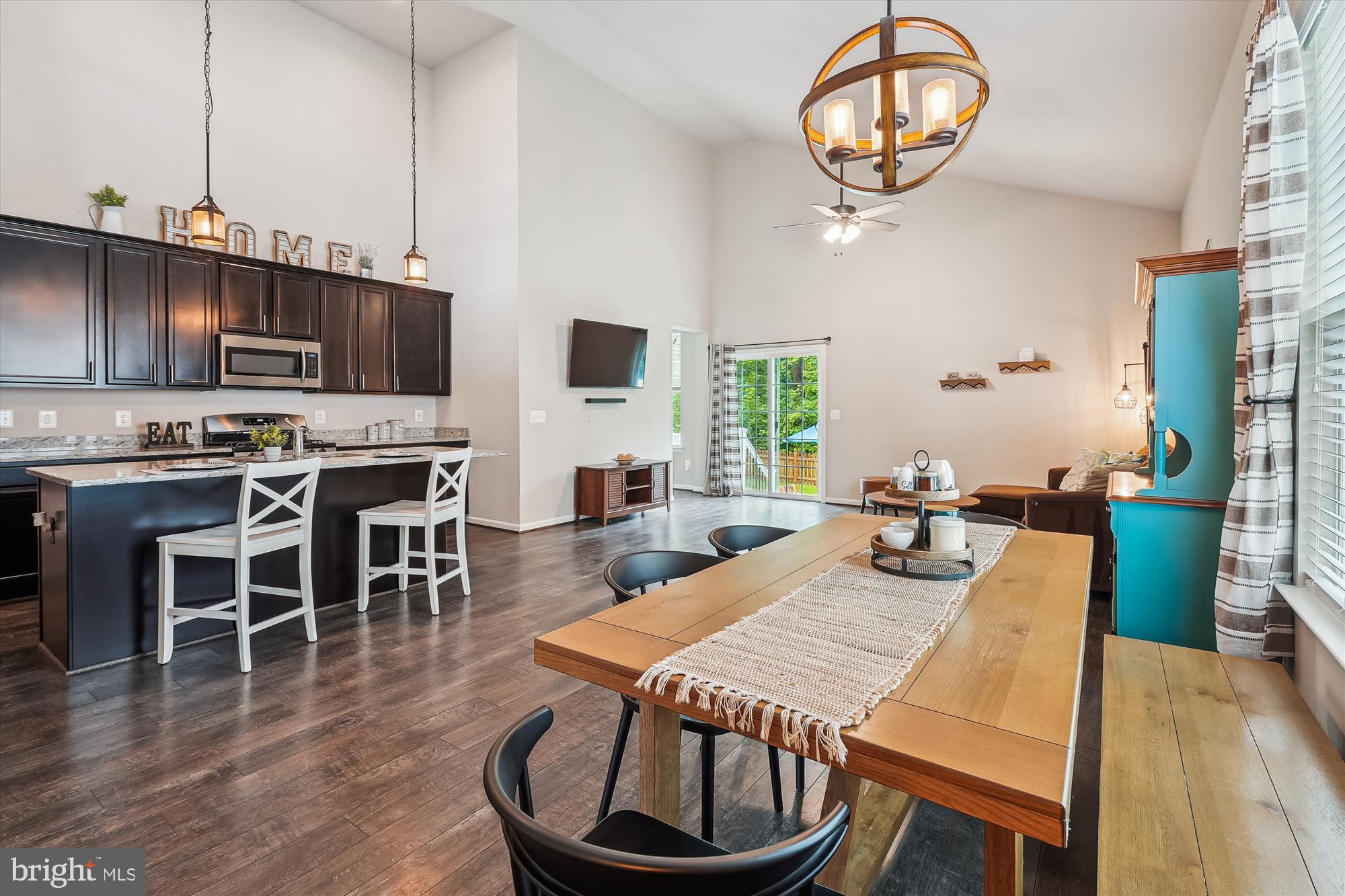 12141 Aster Road Bristow, VA 20136 - Photo 9 of 65 a view of a dining room with furniture window and wooden floor