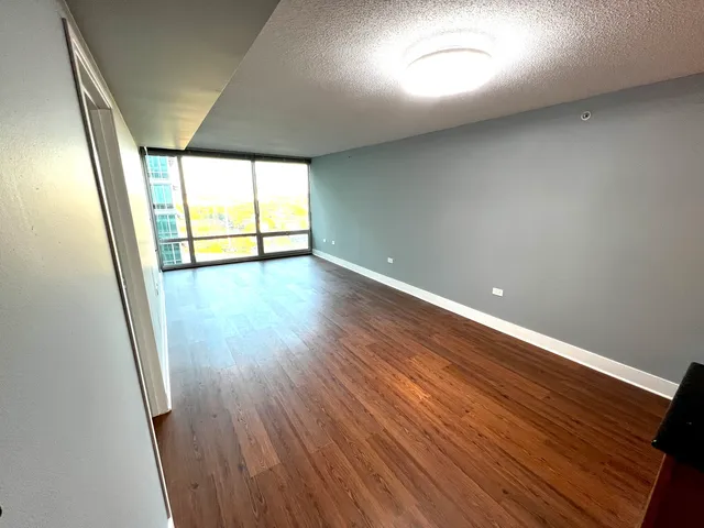 a kitchen with stainless steel appliances granite countertop a stove a refrigerator and a sink