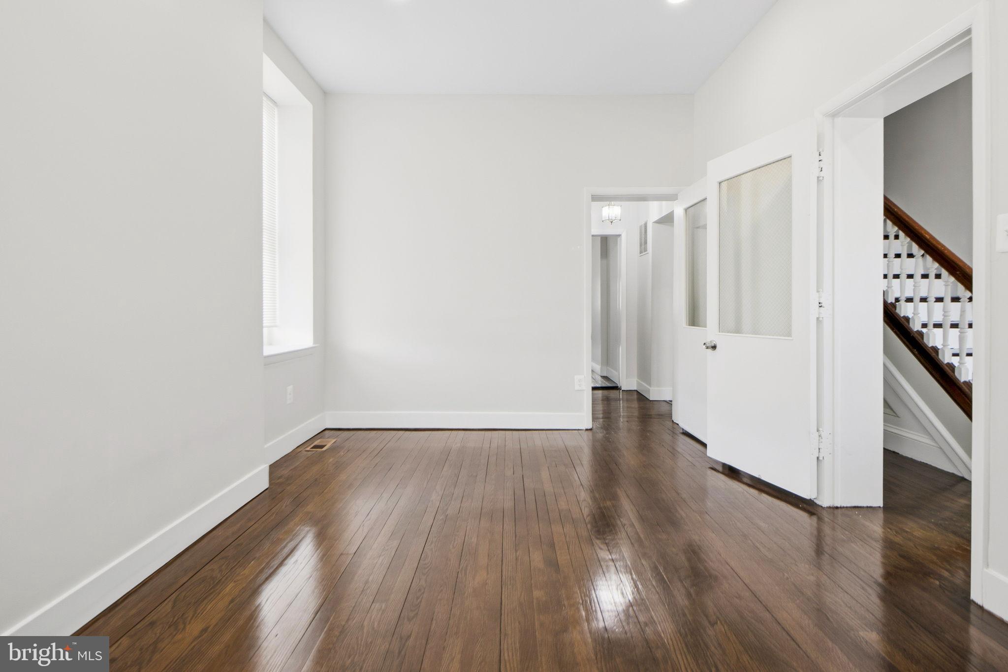 317 East Patapsco Avenue Baltimore, MD 21225 - Photo 12 of 36 Bright and airy entryway with polished floors.