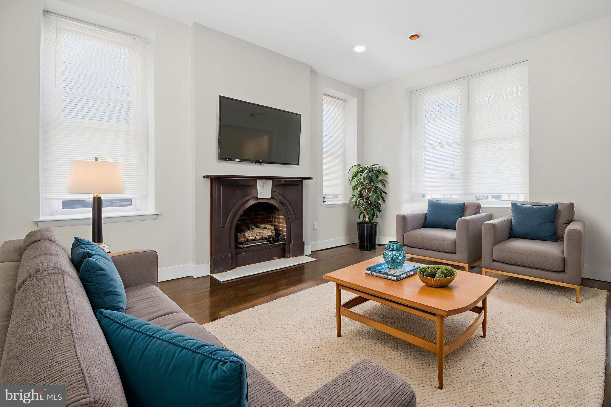 317 East Patapsco Avenue Baltimore, MD 21225 - Photo 18 of 36 Bright and inviting living space, virtually staged