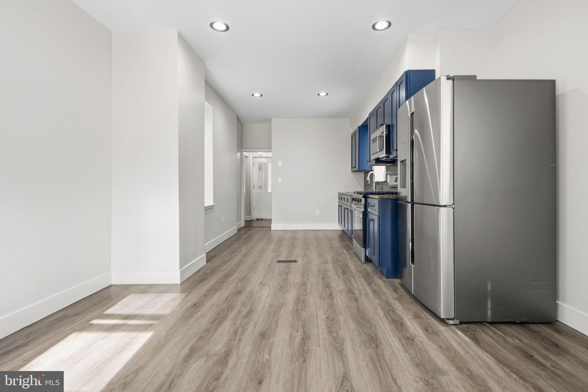 317 East Patapsco Avenue Baltimore, MD 21225 - Photo 25 of 36 Modern kitchen with sleek finishes.