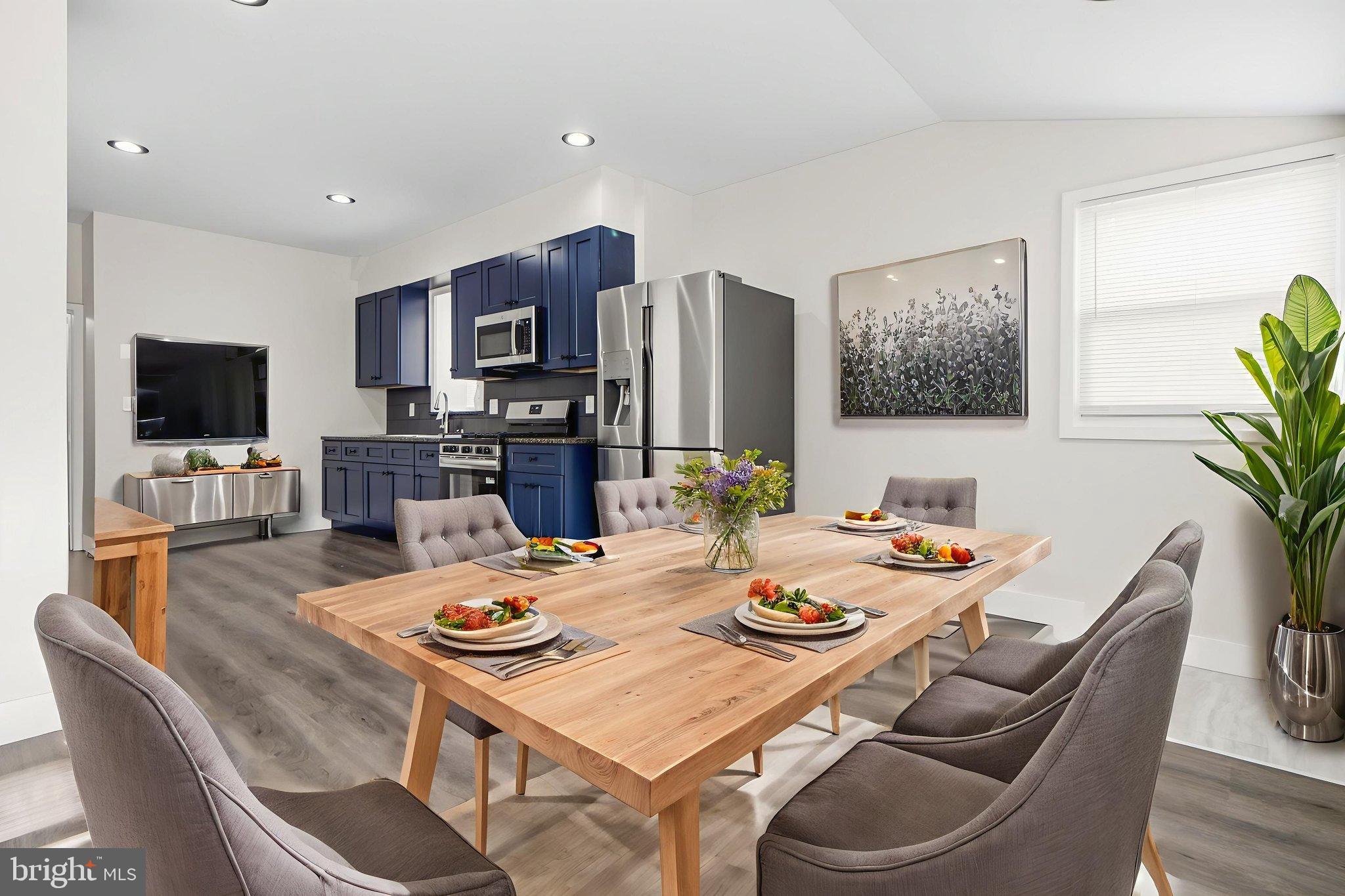 317 East Patapsco Avenue Baltimore, MD 21225 - Photo 27 of 36 Modern kitchen with dining area, virtually staged