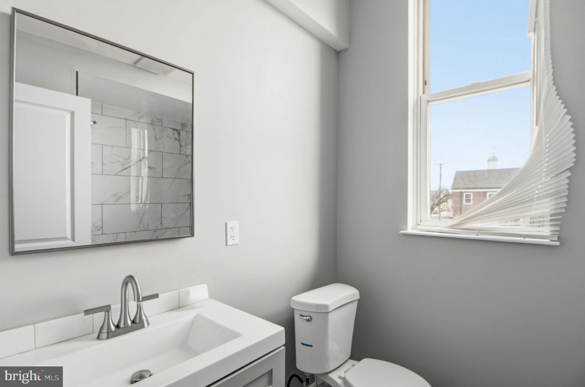 317 East Patapsco Avenue Baltimore, MD 21225 - Photo 34 of 36 Bright and modern bathroom with natural light.