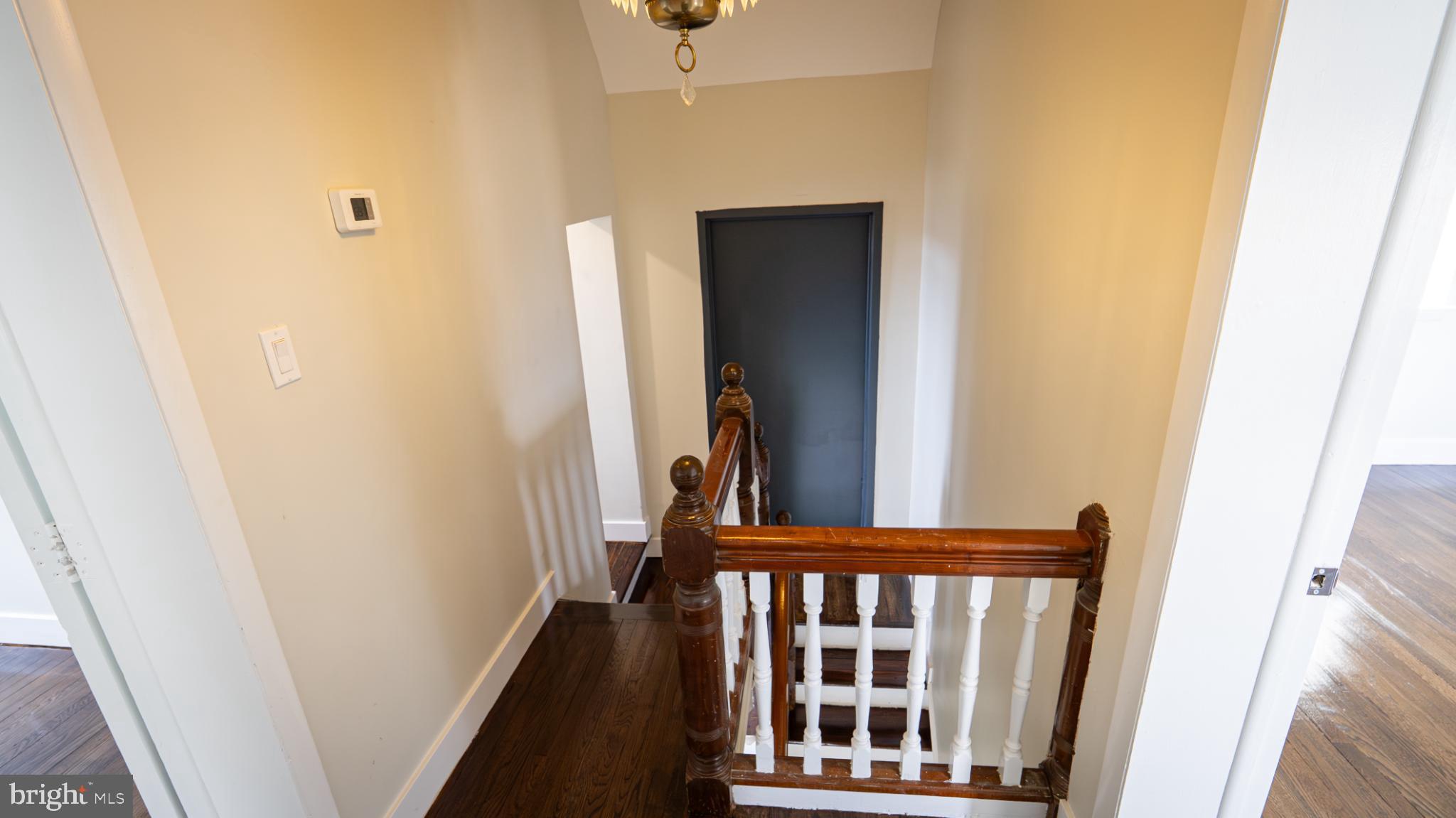 317 East Patapsco Avenue Baltimore, MD 21225 - Photo 36 of 36 Elegant staircase with vintage charm.