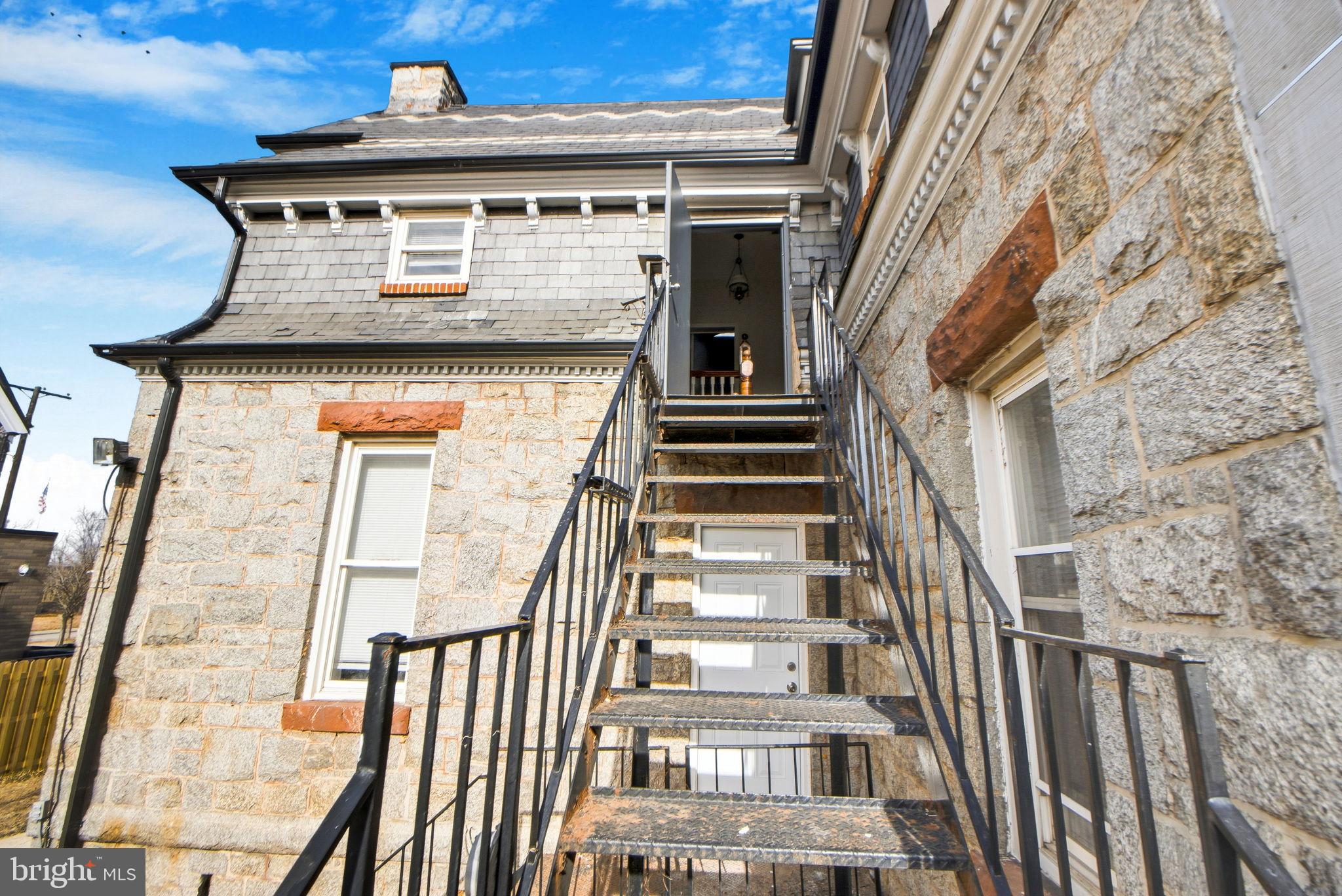 317 East Patapsco Avenue Baltimore, MD 21225 - Photo 7 of 36 Charming stone exterior with inviting stairs.