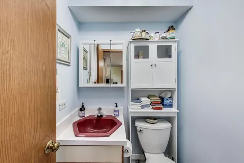 a kitchen with a sink cabinets and window