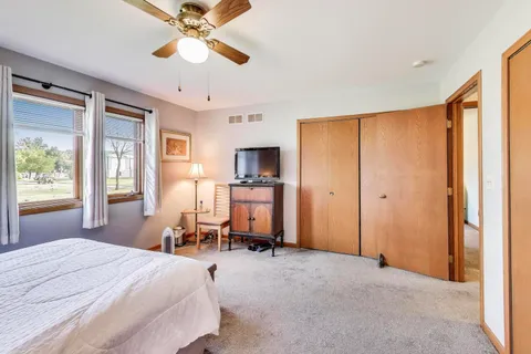 a bedroom with a bed furniture and a window