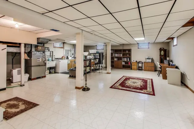 a living room with lots of furniture and white walls