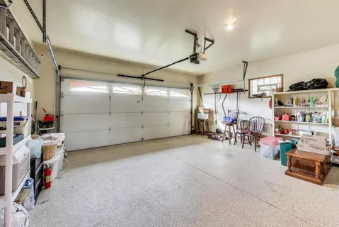 a room with furniture and white walls