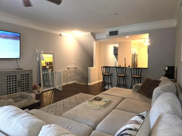 a living room with furniture window and lamp