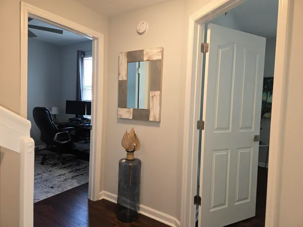 a view of entryway with wooden floor