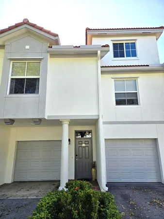a front view of a house with a garage