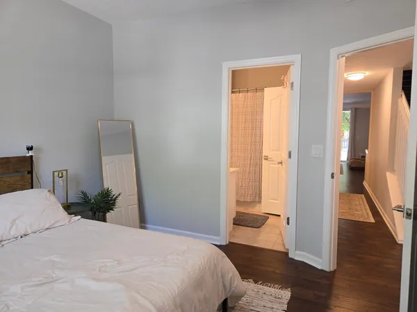 a bedroom with a bed and a mirror