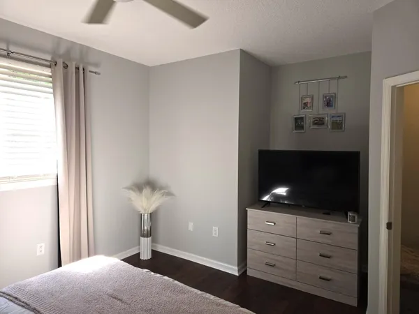 a bedroom with a bed and a fireplace