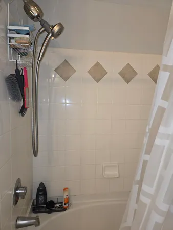 a bathroom with a sink and a shower
