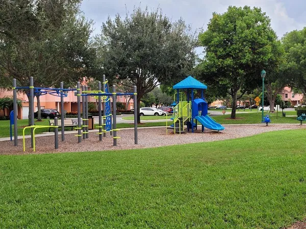 a view of a park with swings