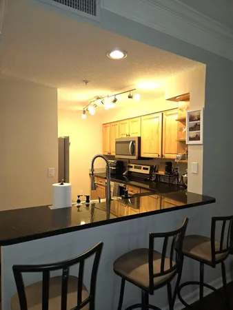 a dining room with table and chairs