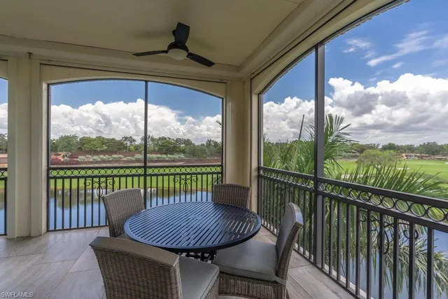 a view of a chair and table in the balcony