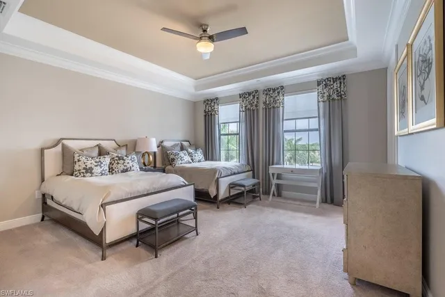 a bathroom with a sink a toilet a mirror and shower