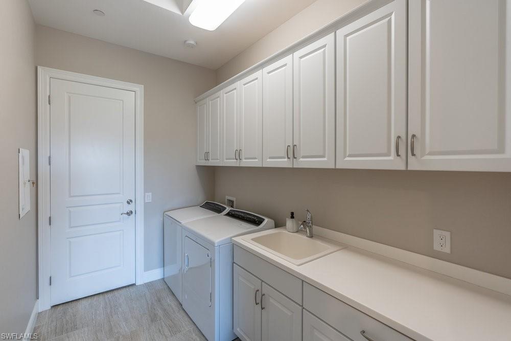 16444 Carrara Way, Unit 7301 Naples, FL 34110 - Photo 28 of 42 a view of a storage and utility room with sink