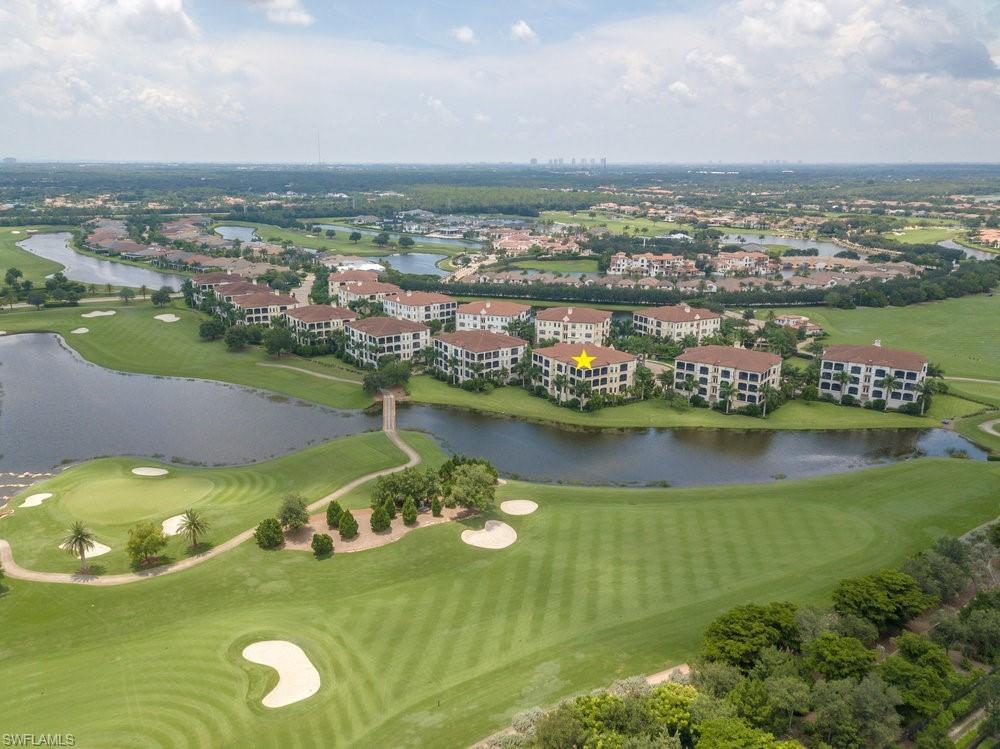 16444 Carrara Way, Unit 7301 Naples, FL 34110 - Photo 35 of 42 an aerial view of residential houses with outdoor space