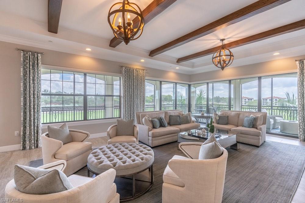 16444 Carrara Way, Unit 7301 Naples, FL 34110 - Photo 5 of 42 a living room with furniture and a large window