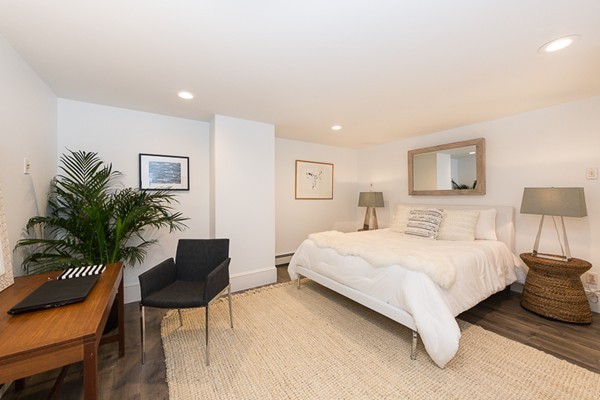 26 Vinal Avenue, Unit 1 Somerville, MA 02143 - Photo 15 of 17 a bedroom with a bed and a chair