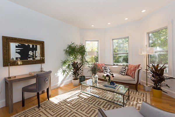 26 Vinal Avenue, Unit 1 Somerville, MA 02143 - Photo 2 of 17 a living room with furniture and a large window