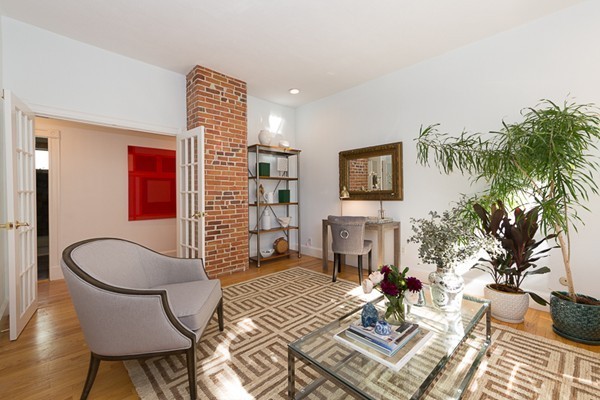 26 Vinal Avenue, Unit 1 Somerville, MA 02143 - Photo 3 of 17 a living room with furniture and a potted plant