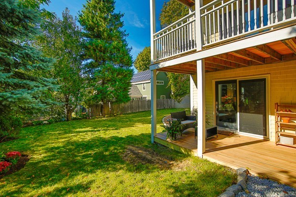 26 Vinal Avenue, Unit 1 Somerville, MA 02143 - Photo 5 of 17 a view of a house with backyard and sitting area