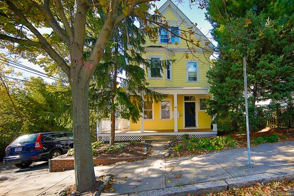 26 Vinal Avenue, Unit 1 Somerville, MA 02143 - Photo 7 of 17 a front view of a house with a yard and tree s