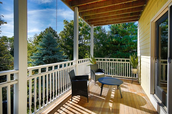 26 Vinal Avenue, Unit 1 Somerville, MA 02143 - Photo 8 of 17 a view of a chair and table in the balcony