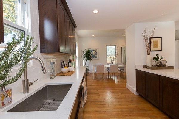 26 Vinal Avenue, Unit 1 Somerville, MA 02143 - Photo 10 of 17 a very nice looking kitchen with granite countertop a large counter top and stainless steel appliances