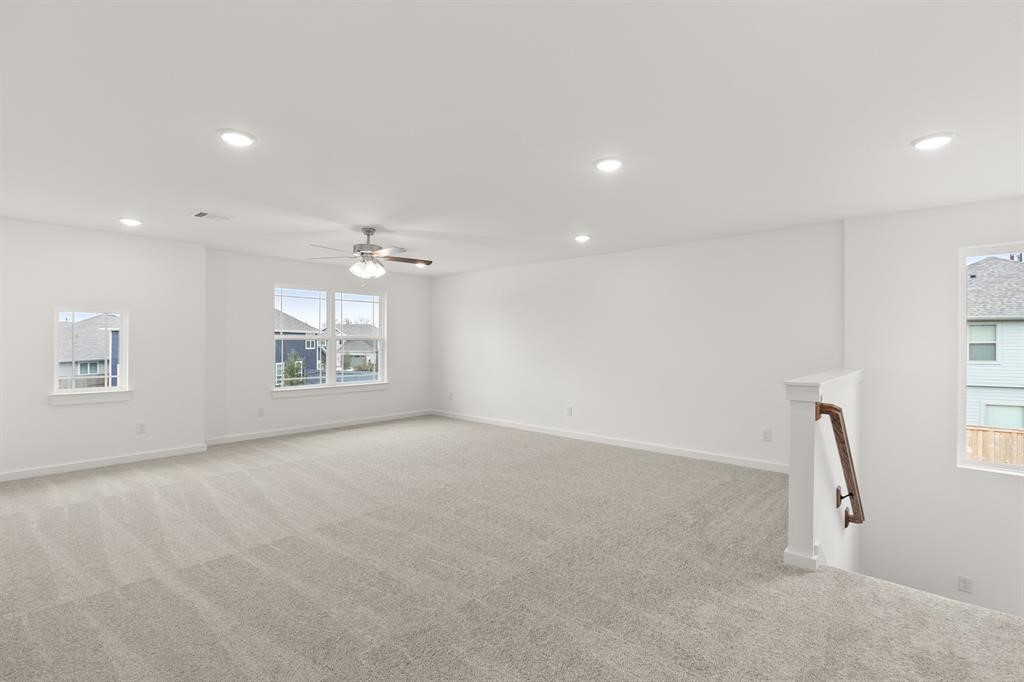 8239 Red Shiner Way Fulshear, TX 77441 - Photo 12 of 25 an empty room with windows and entrance