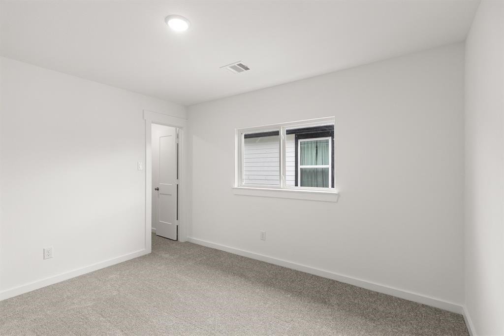8239 Red Shiner Way Fulshear, TX 77441 - Photo 13 of 25 a view of an empty room with a window