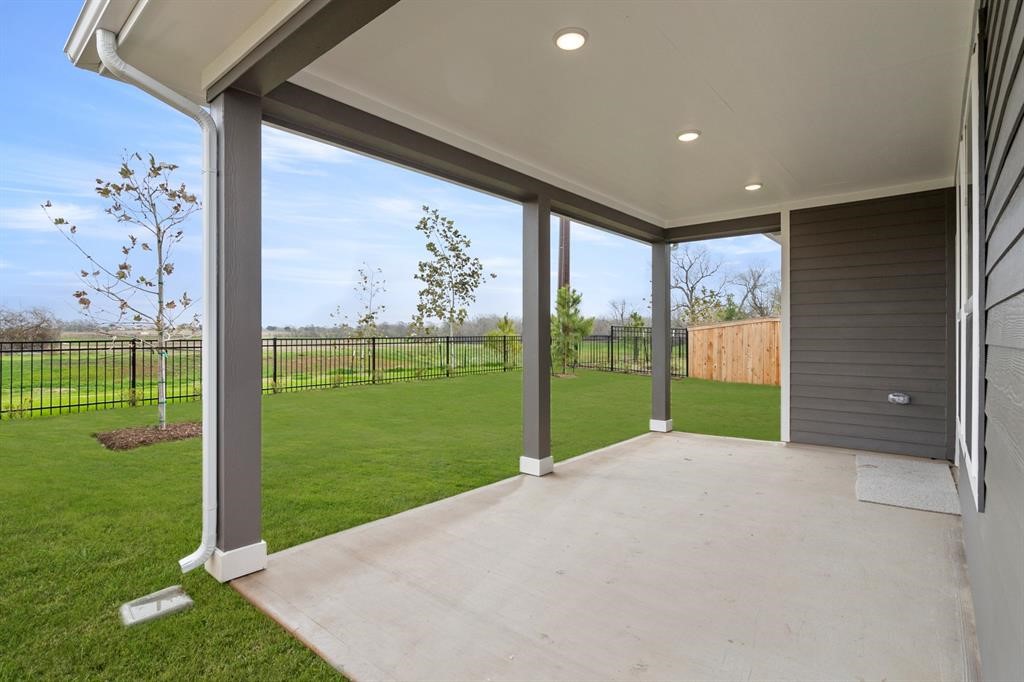 8239 Red Shiner Way Fulshear, TX 77441 - Photo 18 of 25 a view of a garden with an outdoor space