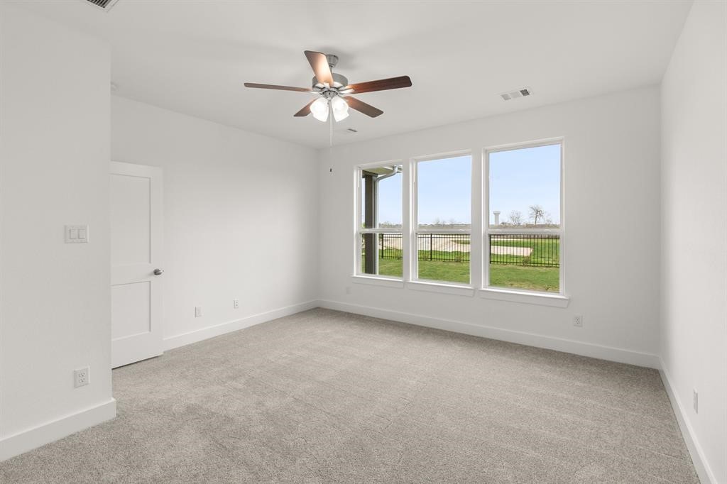 8239 Red Shiner Way Fulshear, TX 77441 - Photo 7 of 25 a view of an empty room with a window