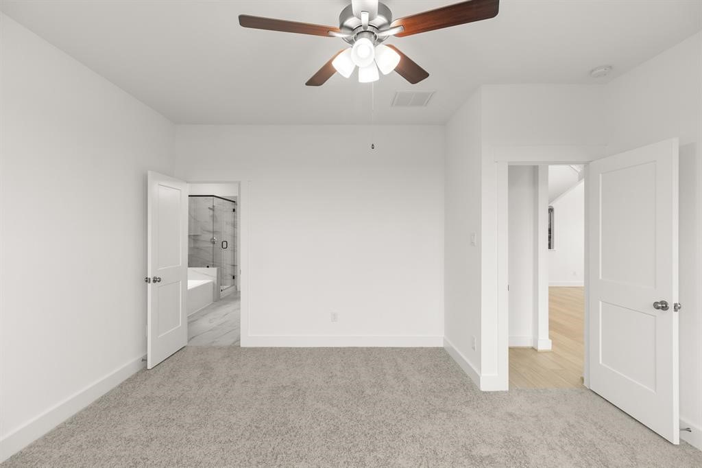 8239 Red Shiner Way Fulshear, TX 77441 - Photo 8 of 25 a view of an empty room and chandelier fan