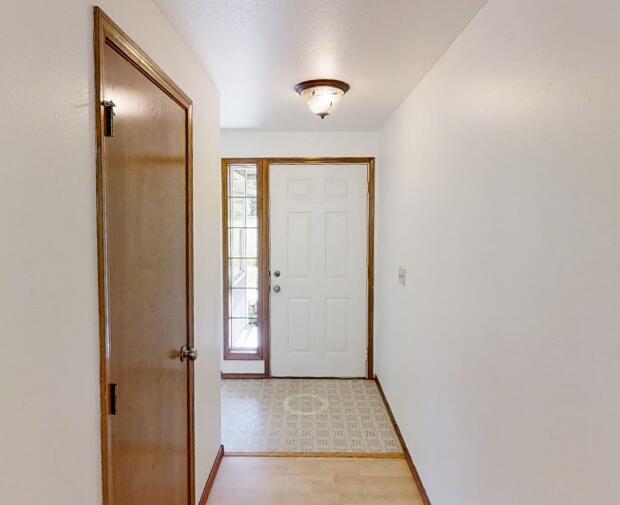 4748 Upper Applegate Road Jacksonville, OR 97530 - Photo 29 of 31 a view of a hallway with wooden floor