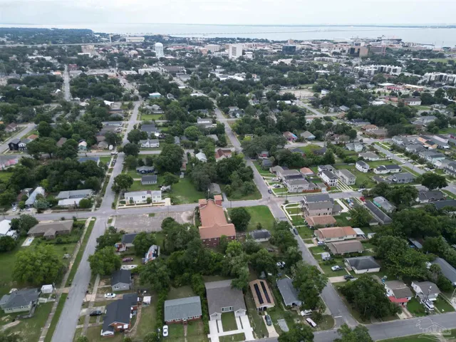 a front view of a house with a garden and yard