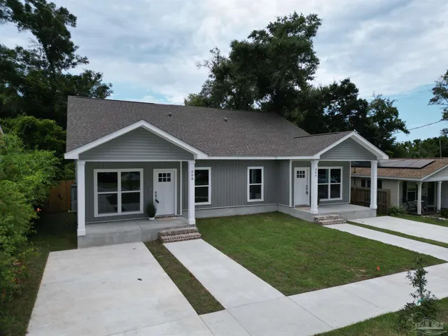 a picture of a bench in front of a building