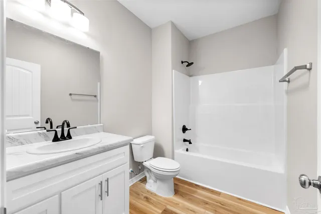 a bathroom with a sink a toilet and a tub