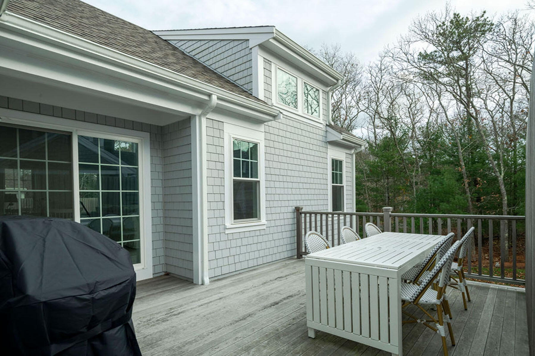 39 Cottage Lane Mashpee, MA 02649 - Photo 5 of 35 a roof deck with a table and chairs