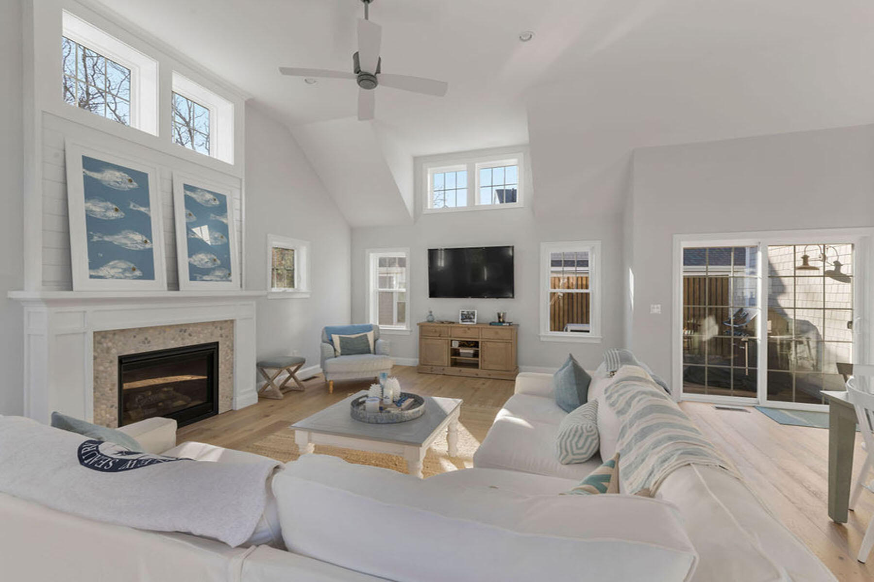 39 Cottage Lane Mashpee, MA 02649 - Photo 9 of 35 a living room with furniture a fireplace and a flat screen tv