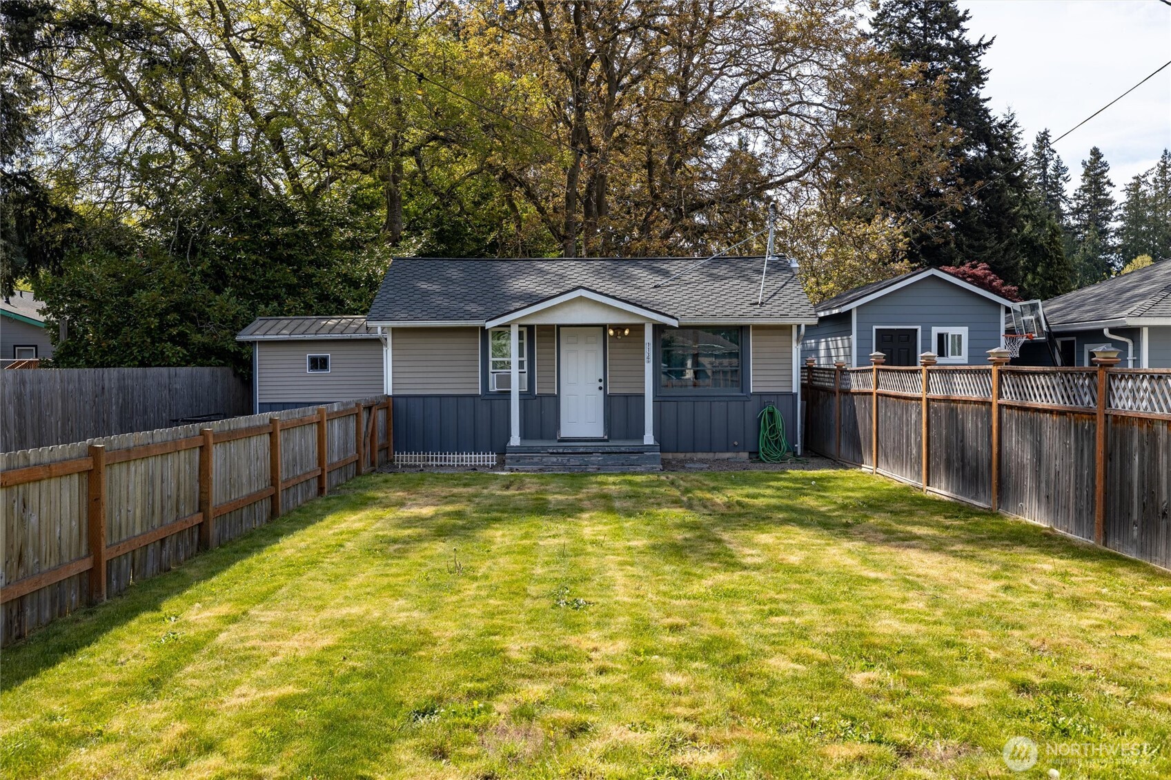 113 South Gardner Road Burlington, WA 98233 - Photo 30 of 40 a view of a house with a large pool and wooden fence