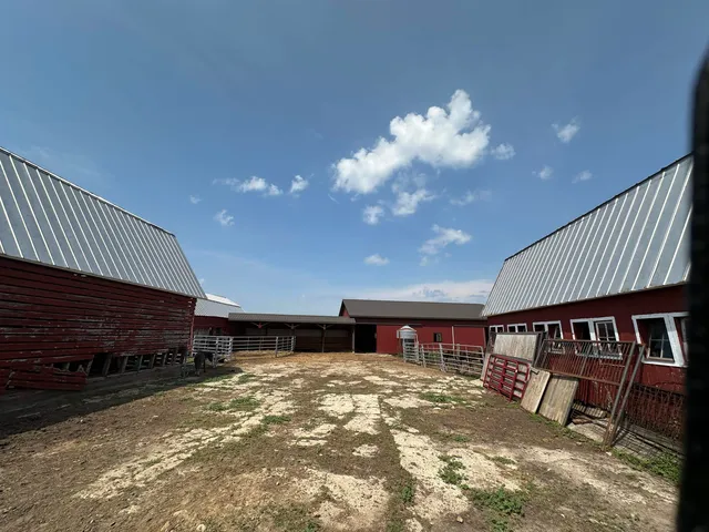 a bedroom with furniture and a flat screen tv